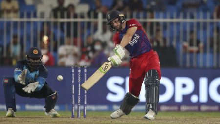 Jos Buttler’s century aids England’s 26-run victory over Sri Lanka in the T20 World Cup in Sharjah.