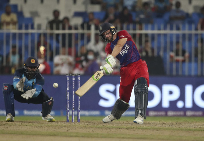 Jos Buttler’s century aids England’s 26-run victory over Sri Lanka in the T20 World Cup in Sharjah.