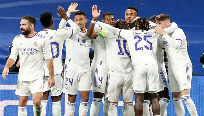 Real Madrid defeated 10-man Inter Milan in the Champions League to finish first in their group.