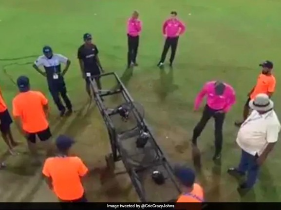 During India’s Asia Cup match against Pakistan, ground staff utilize electric fans to dry out the field.